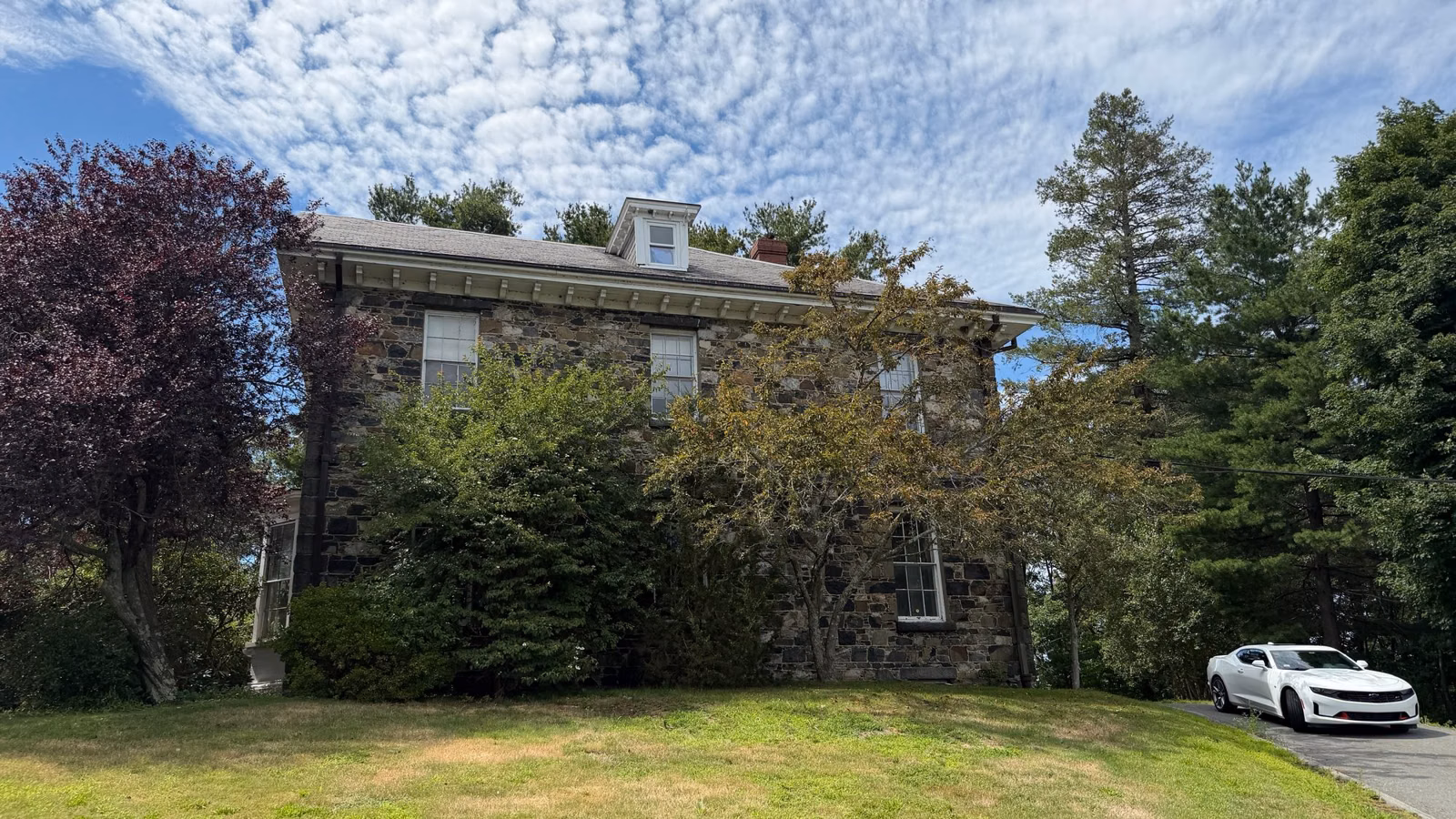 Stone Botume House visitor center behind a lawn, Middlesex Fells, Stoneham