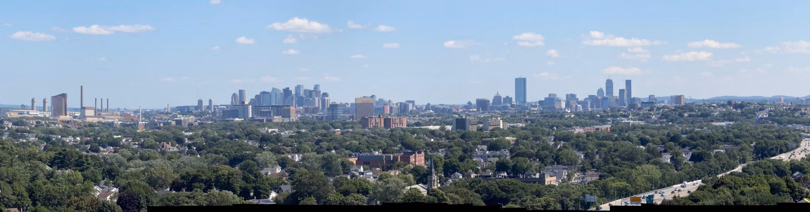 Boston skyline across the treetops from Pine Hill by Wright's Tower, Middlesex Fells, Medford